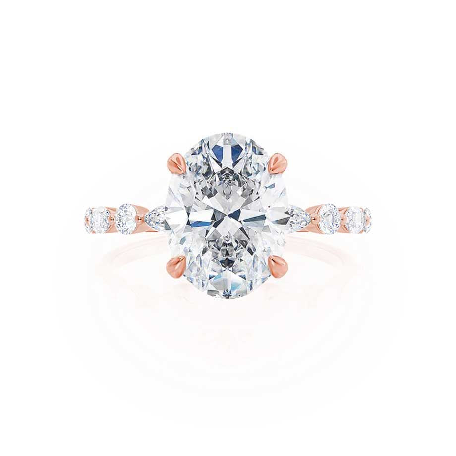 Top angle view of ASTER oval cut lab diamond 18k rose gold scatter ring with side stones