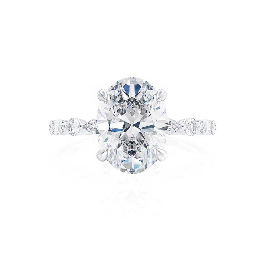 Top angle view of ASTER oval cut lab diamond 18k white gold scatter engagement ring with marquise side stones