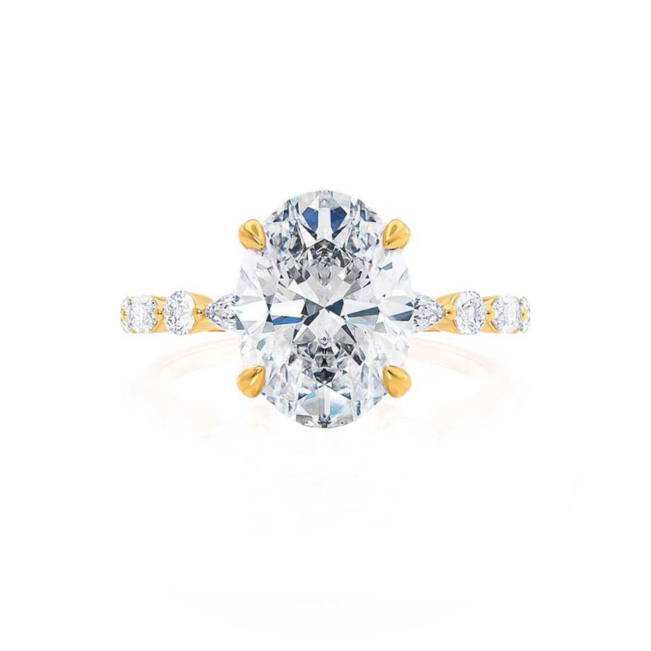 Top angle view of ASTER oval cut lab diamond 18k yellow gold scatter engagement ring with side stones