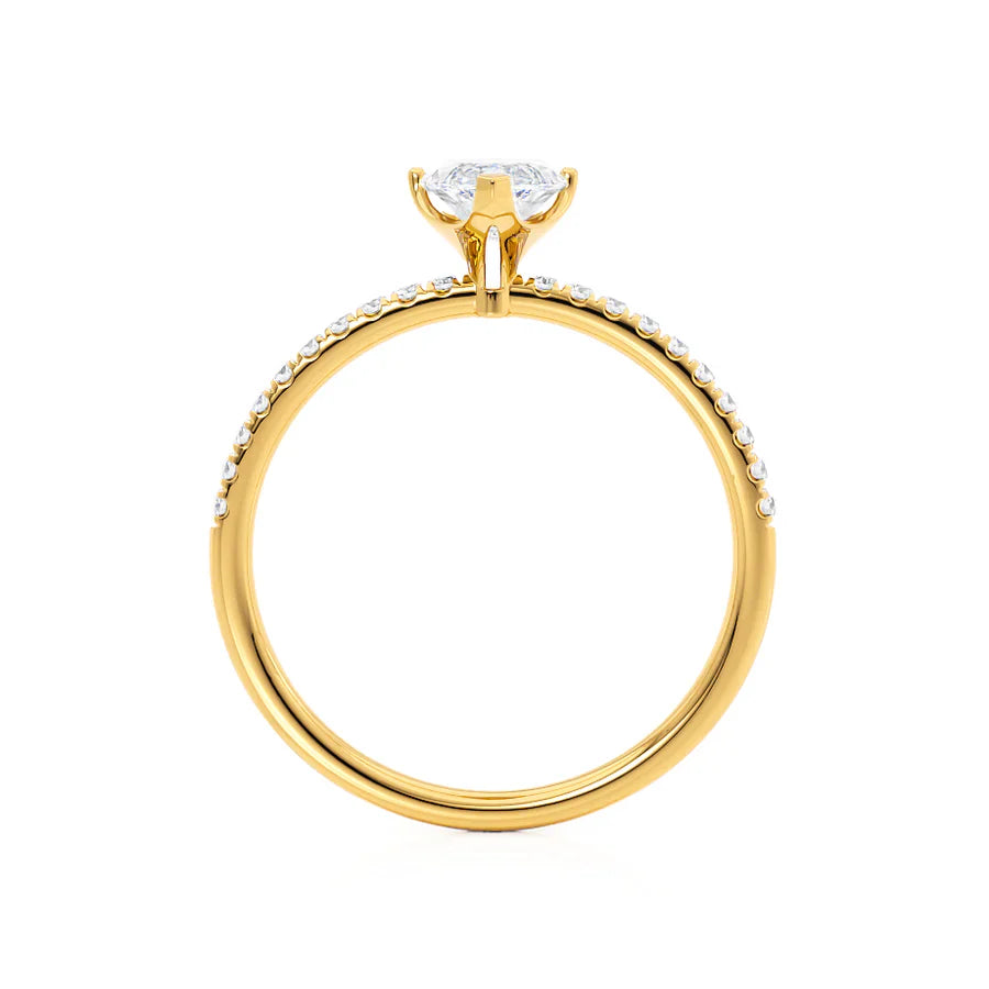 Side view of marquise cut lab diamond solitaire engagement ring in 18k yellow gold