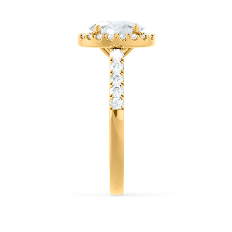 Top view of PEONY oval cut lab diamond 18k yellow gold halo engagement ring, pavé halo and shoulders design