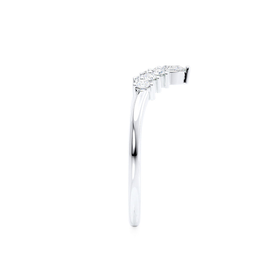 Side profile of curved white gold ring with staggered baguette diamonds, designed to contour around engagement settings.