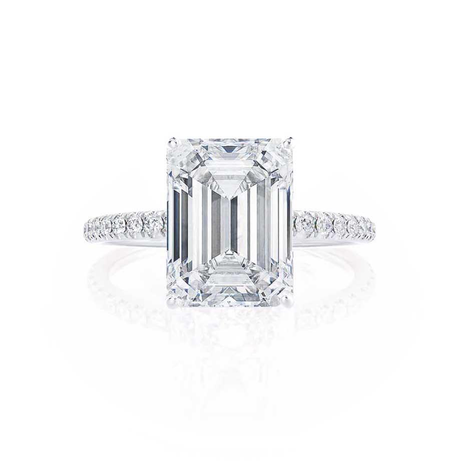 Straight view of emerald cut lab diamond solitaire in 18k white gold pavé band