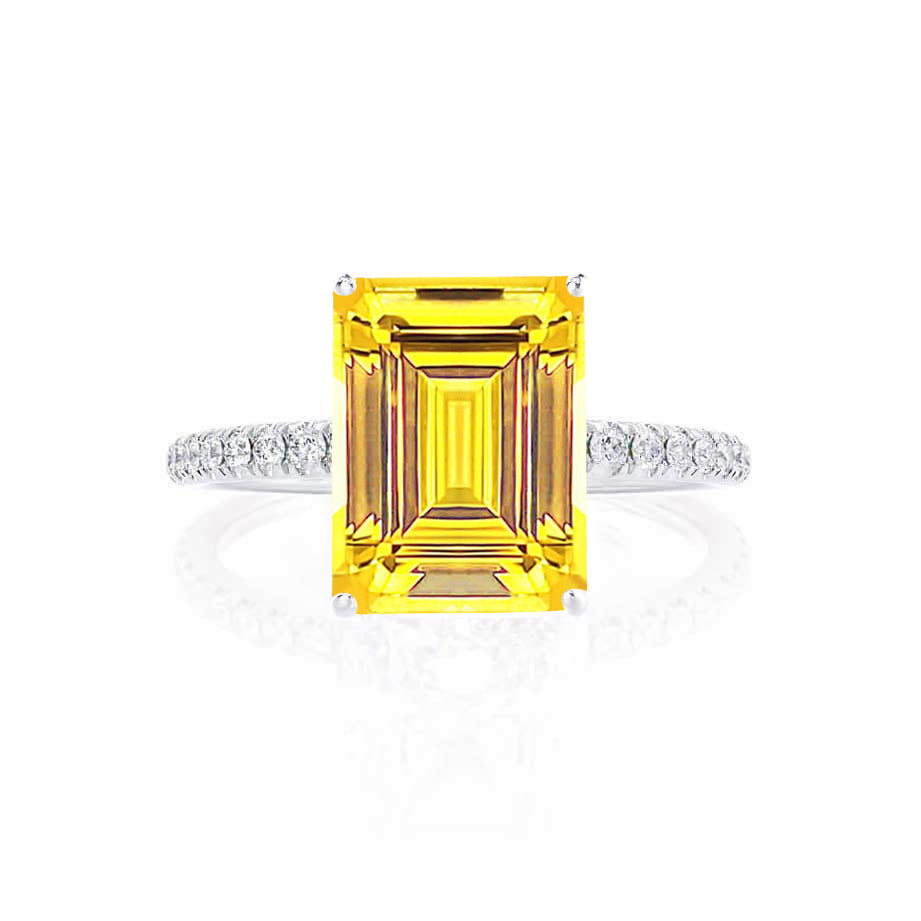 Profile shot emphasizing gemstone elevation, modern minimalism, and pavé placement.