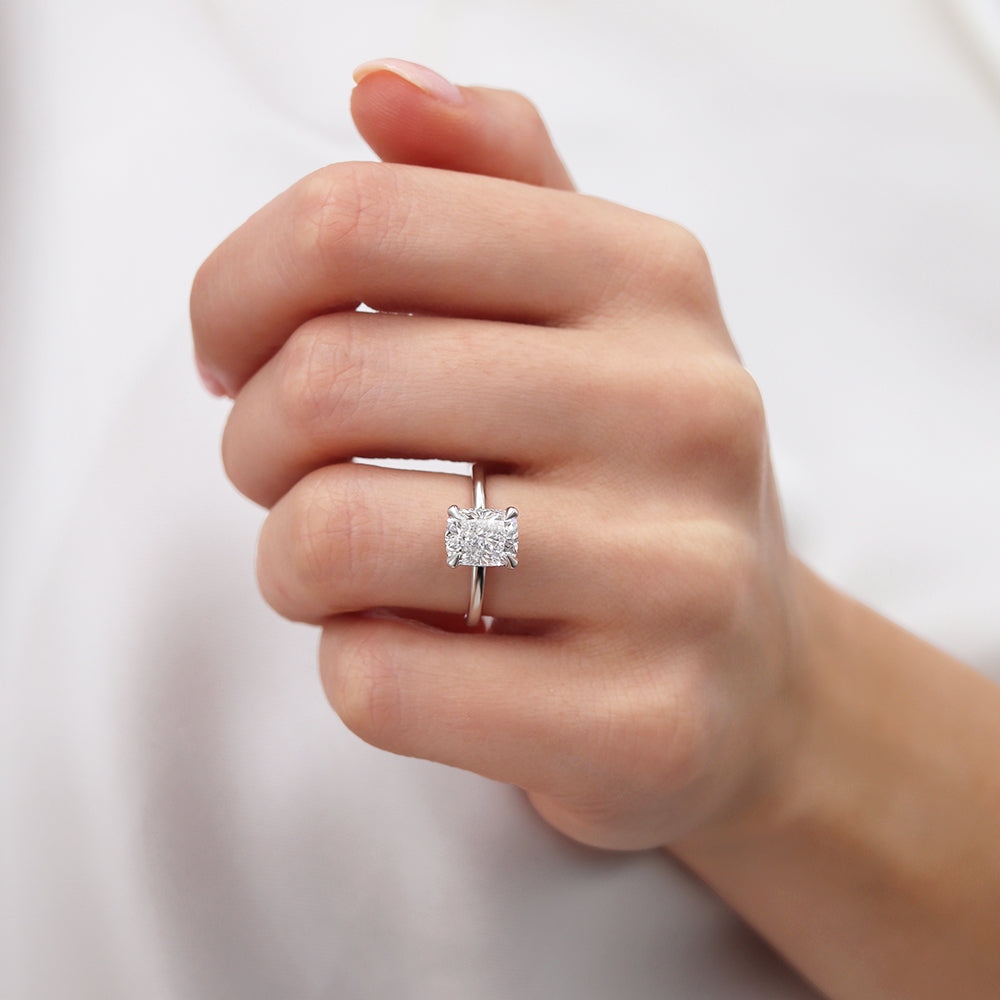 Model hand wearing the ring, highlighting the clarity and elegance of the white gold setting.