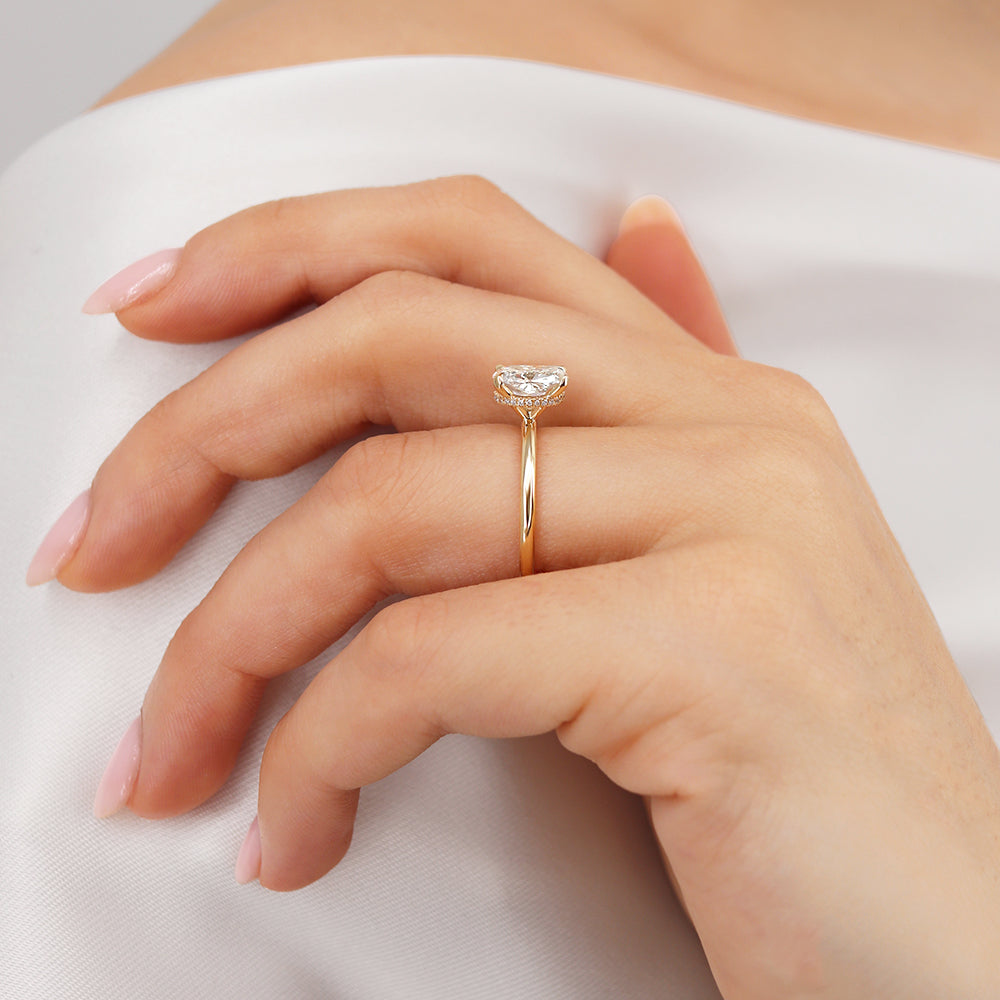 Alternate hand view of the Camellia ring, showing the flattering proportion and elegant band.
