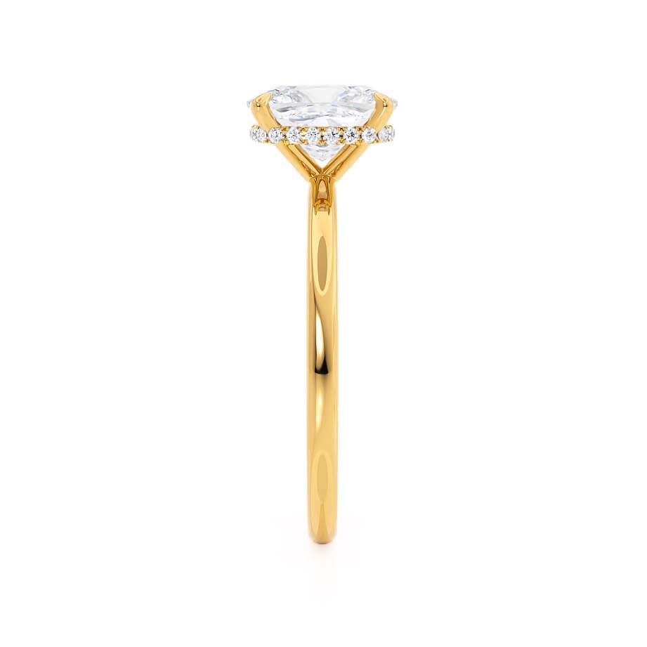 Angled side view of the Camellia ring, featuring the diamond’s elevation and yellow gold setting.