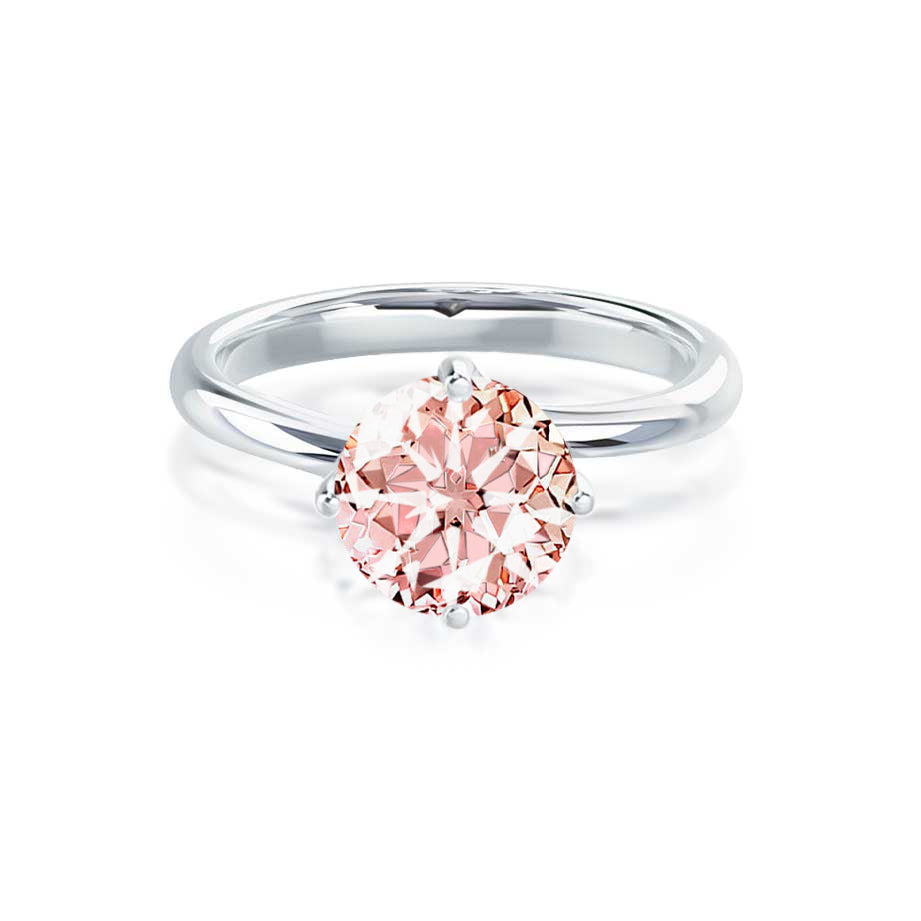 Front view of the Carnation ring showcasing the brilliant round champagne sapphire in a platinum twist setting.