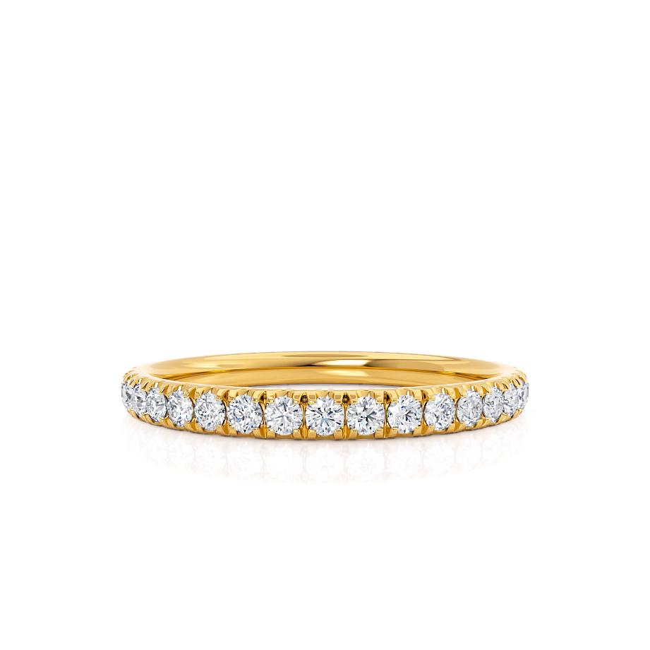 Full eternity yellow gold ring with closely set round diamonds, timeless design.