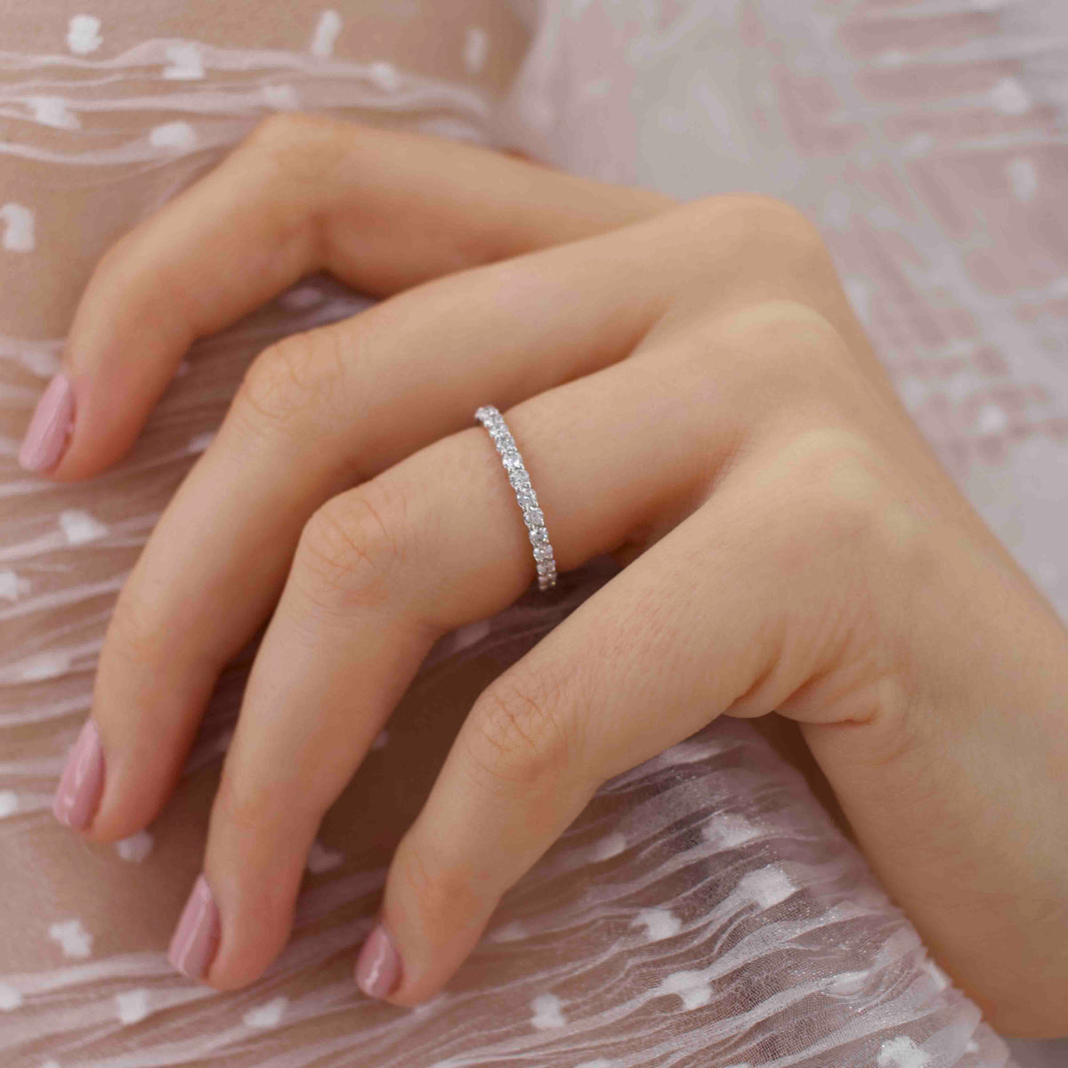 Another angle of the model hand wearing the Luna ring, shot in soft lighting to emphasize texture.
