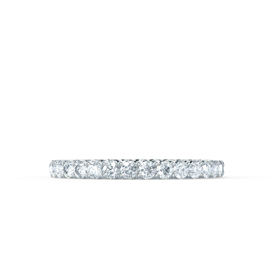 Close-up on the slim profile and low-set diamonds of the band, captured in perfect lighting.