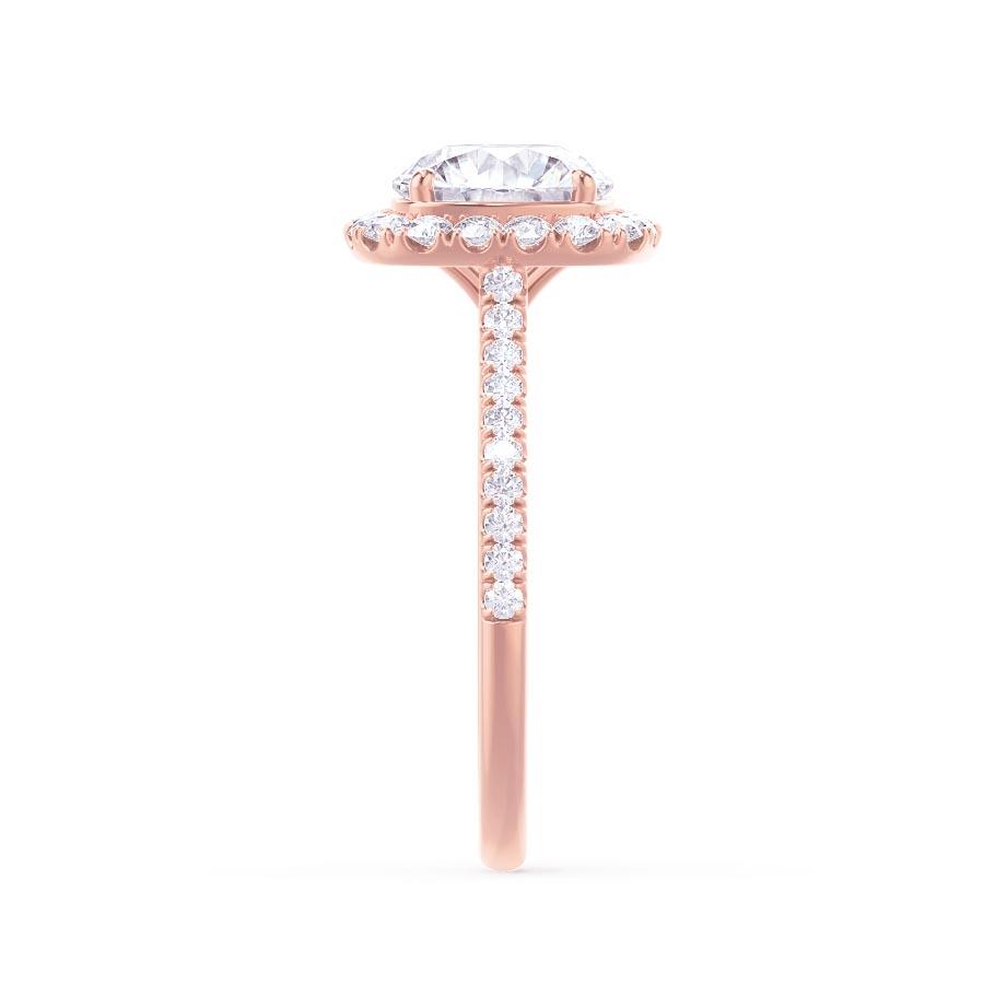 Side view of elongated cushion cut lab diamond halo engagement ring in 18k rose gold