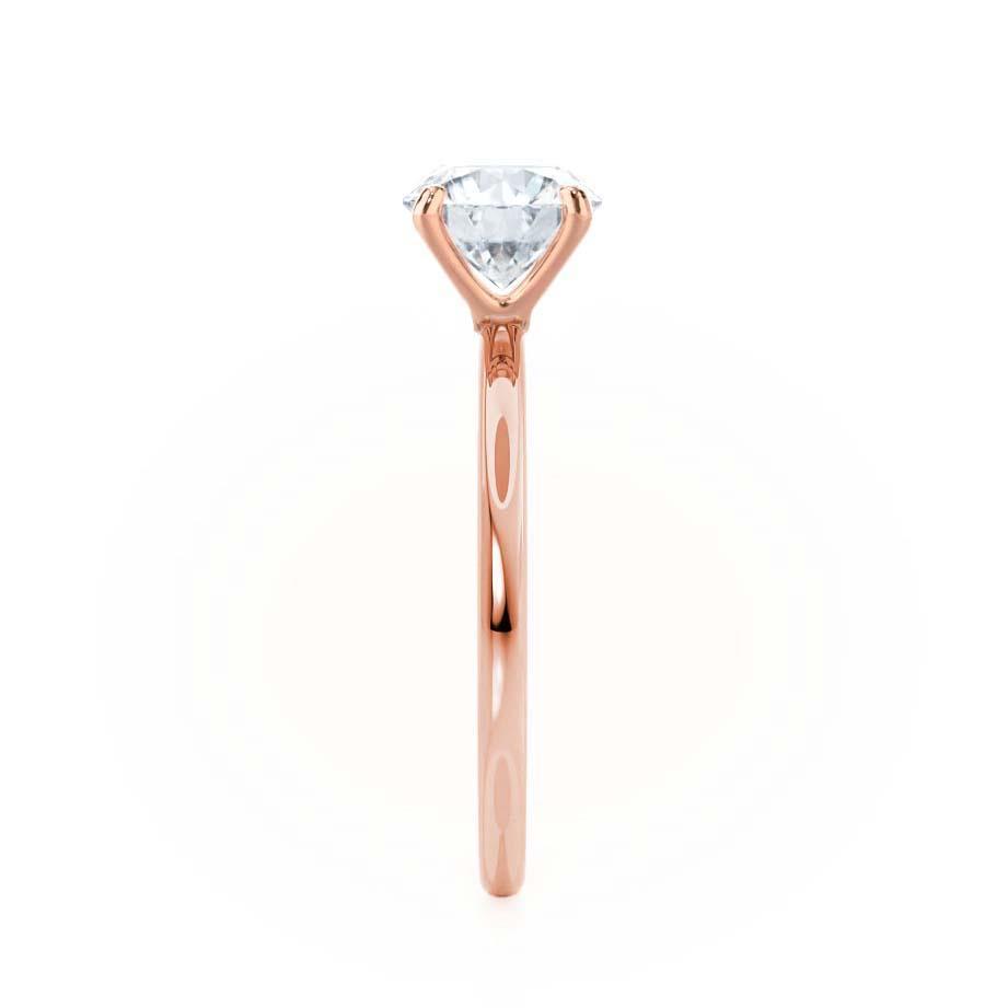 Top view of oval diamond solitaire ring with petite rose gold band