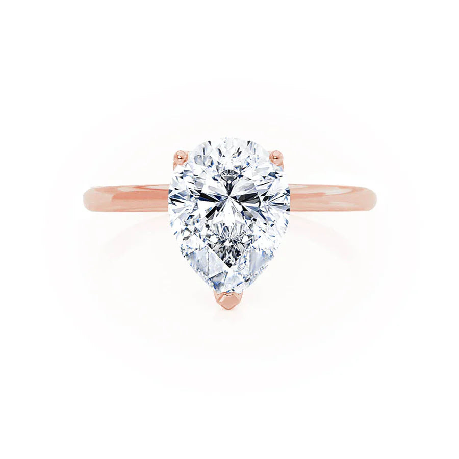 Profile view of pear shaped lab diamond petite solitaire engagement ring in 18k rose gold