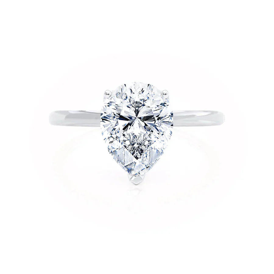 Profile view of pear shaped lab diamond petite solitaire engagement ring in 18k white gold