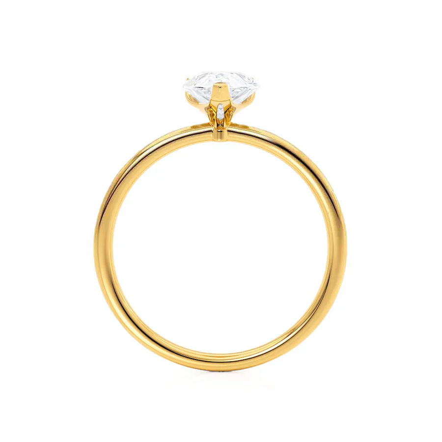 Profile view of pear shaped lab diamond petite solitaire engagement ring in 18k yellow gold