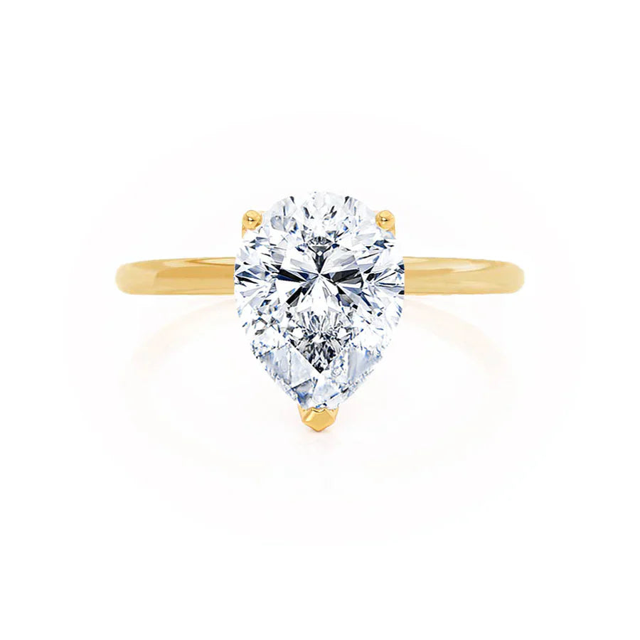 Profile view of pear shaped lab diamond petite solitaire engagement ring in 18k yellow gold