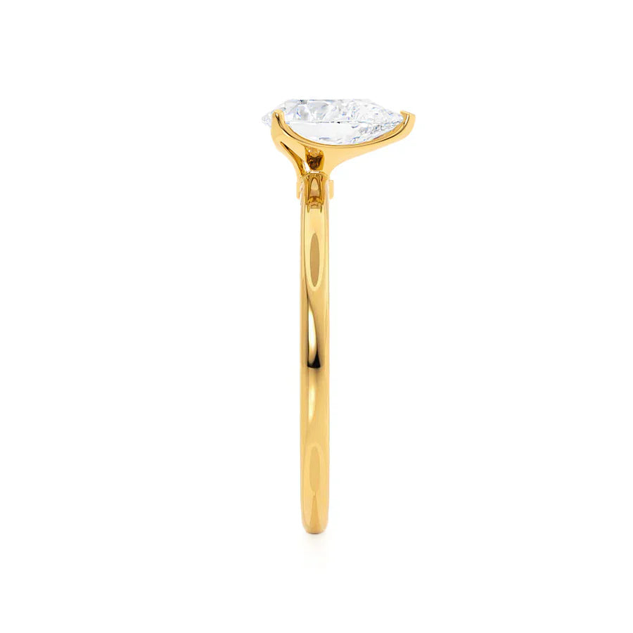 Side view of pear cut lab diamond solitaire engagement ring in 18k yellow gold