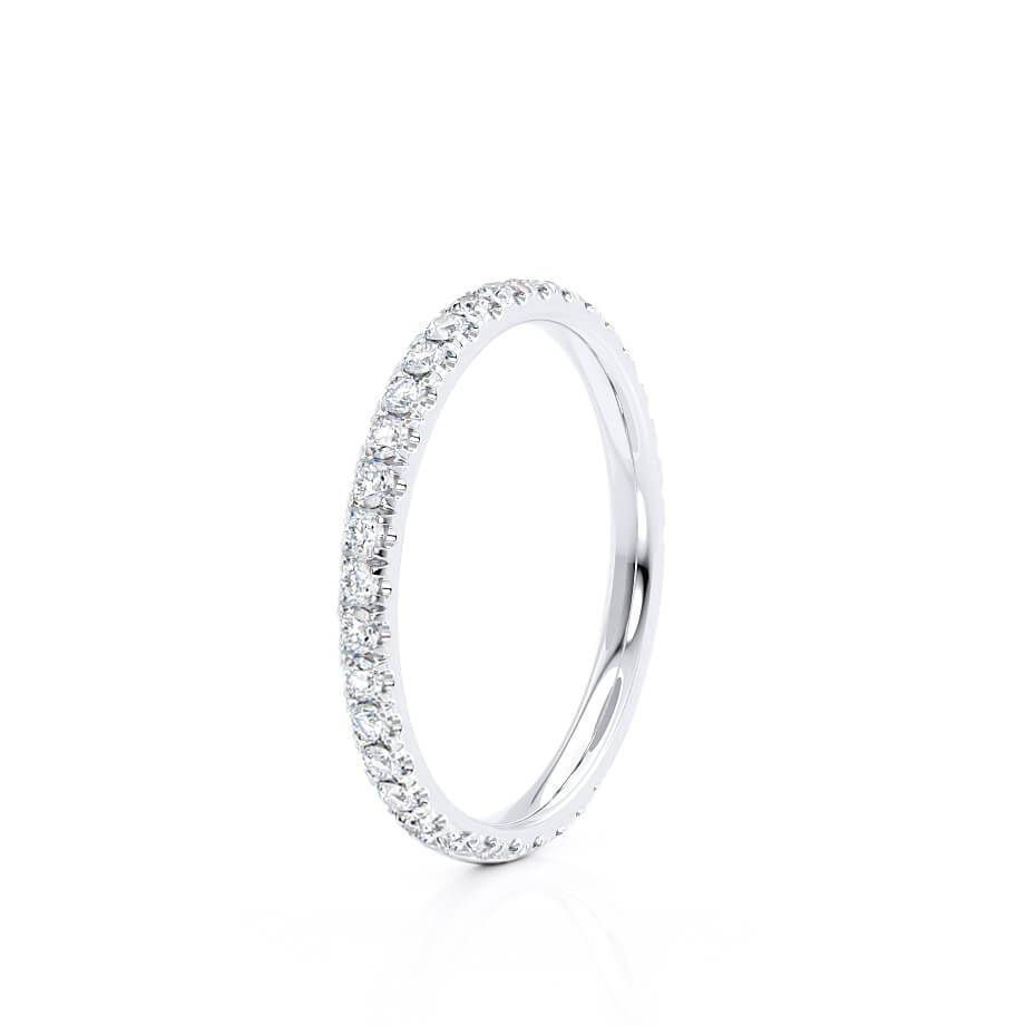 Graceful side curve of a petite eternity ring with finely set pavé diamonds.