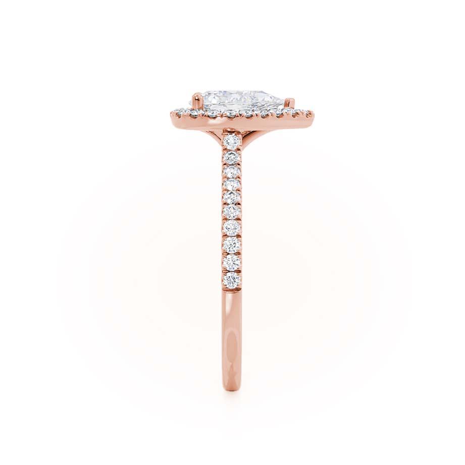 Profile view of pear-shaped lab diamond petite halo engagement ring in 18k rose gold