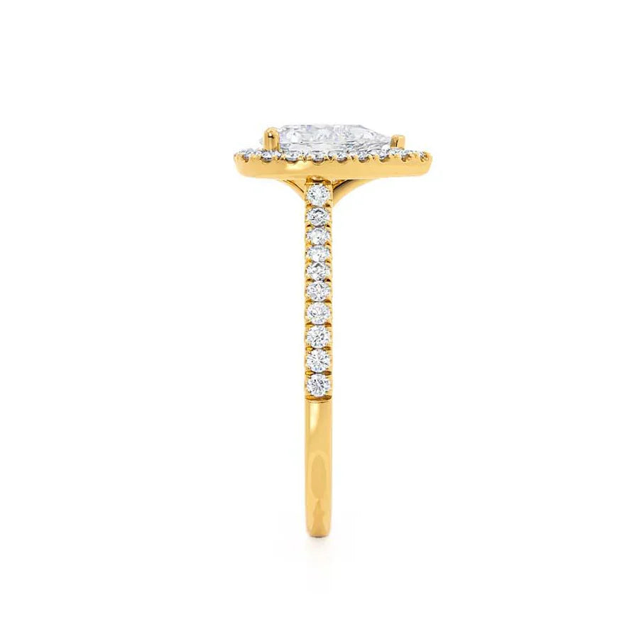 Profile view of pear-shaped lab diamond petite halo engagement ring in 18k yellow gold