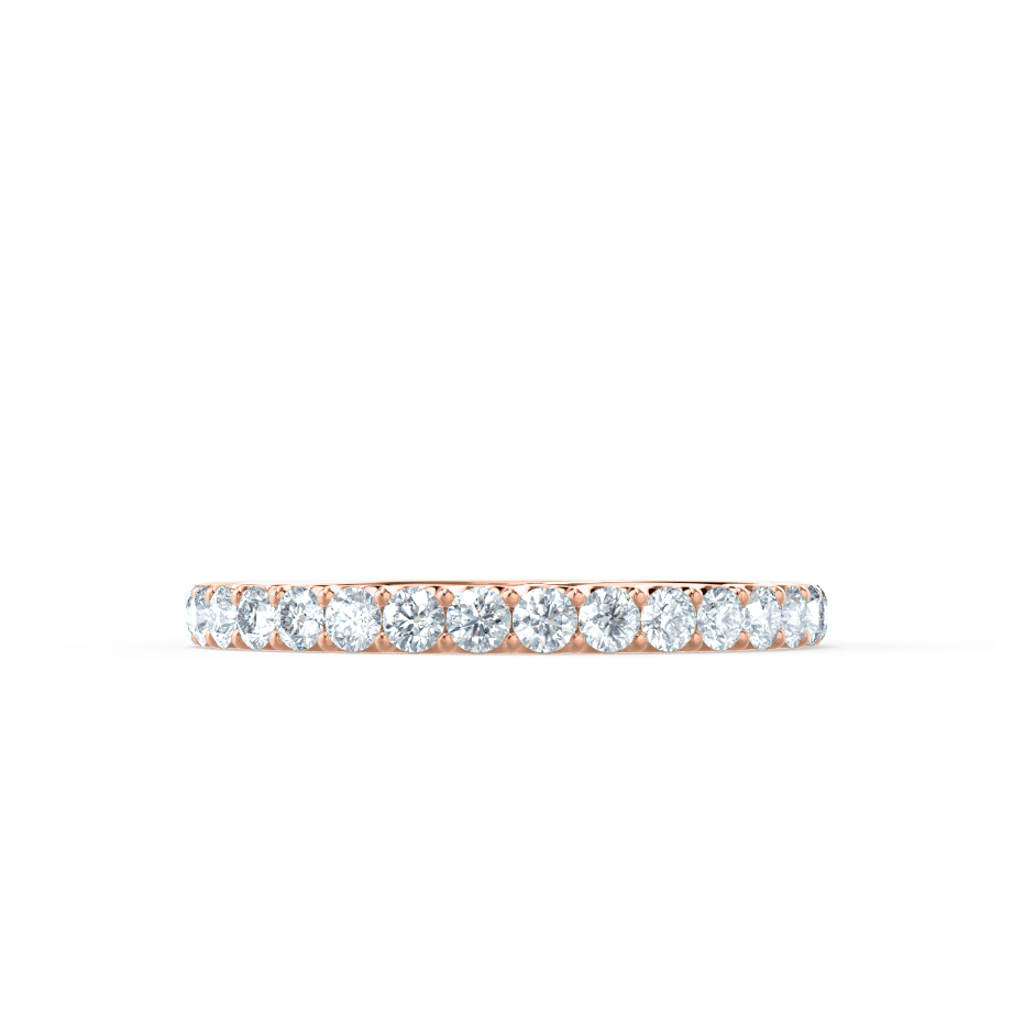 Dainty rose gold diamond band with delicate setting, understated yet dazzling.