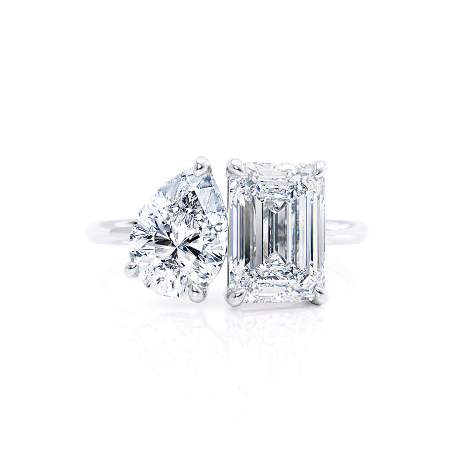 Profile view of Toi Et Moi engagement ring with emerald and pear lab diamonds in platinum