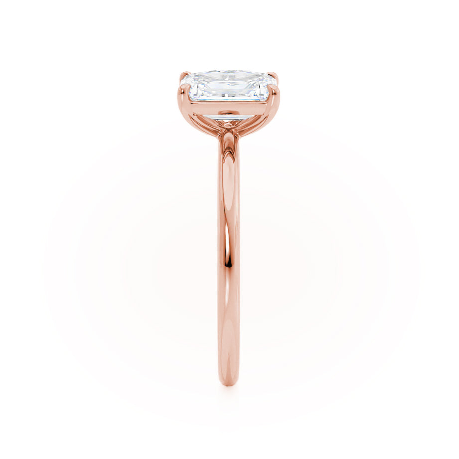 Side profile of Toi Et Moi engagement ring with emerald and pear lab diamonds in 18k rose gold