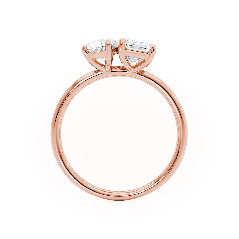 Top view of emerald and pear cut Toi Et Moi engagement ring in 18k rose gold