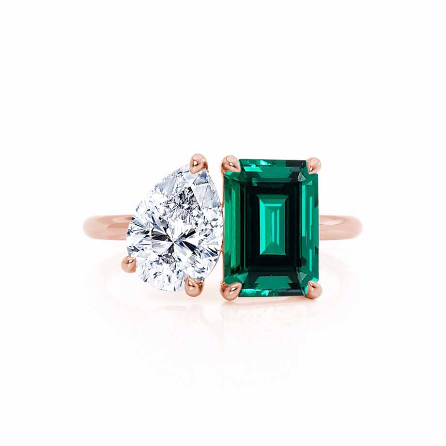 Angled view – Offers a rich visual of both center stones glowing against the rose gold shank.