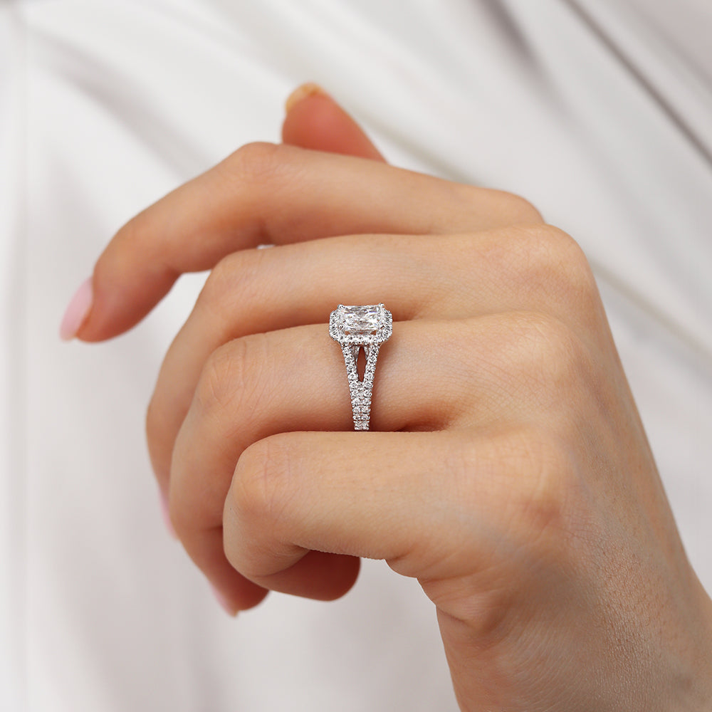 Side view of radiant cut lab diamond halo engagement ring with split shank design