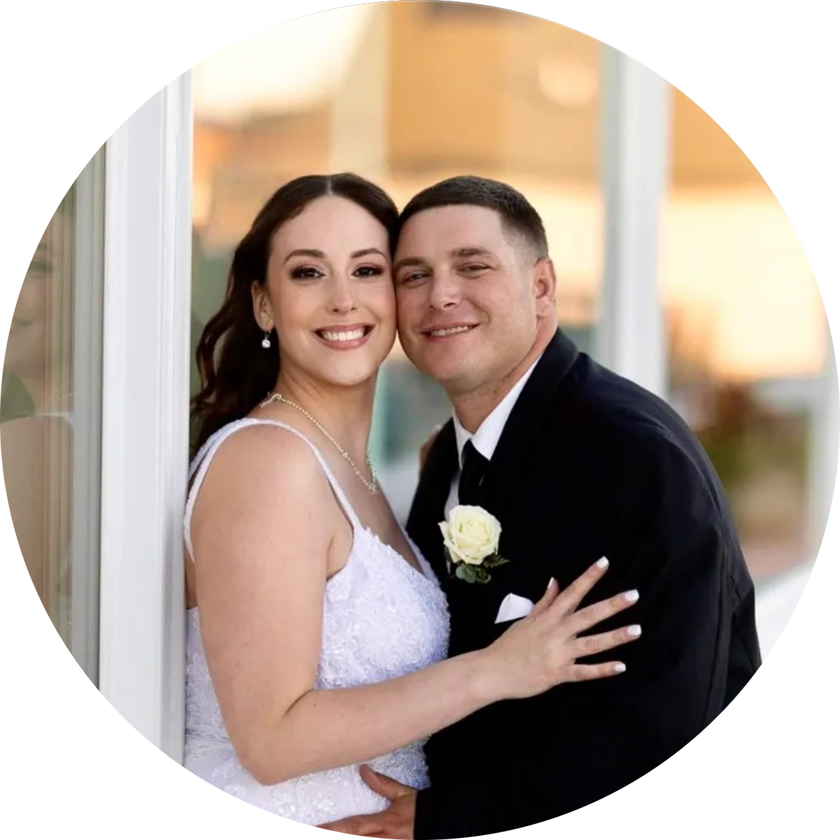 Bride and groom smiling on their wedding day, outdoor portrait with natural light