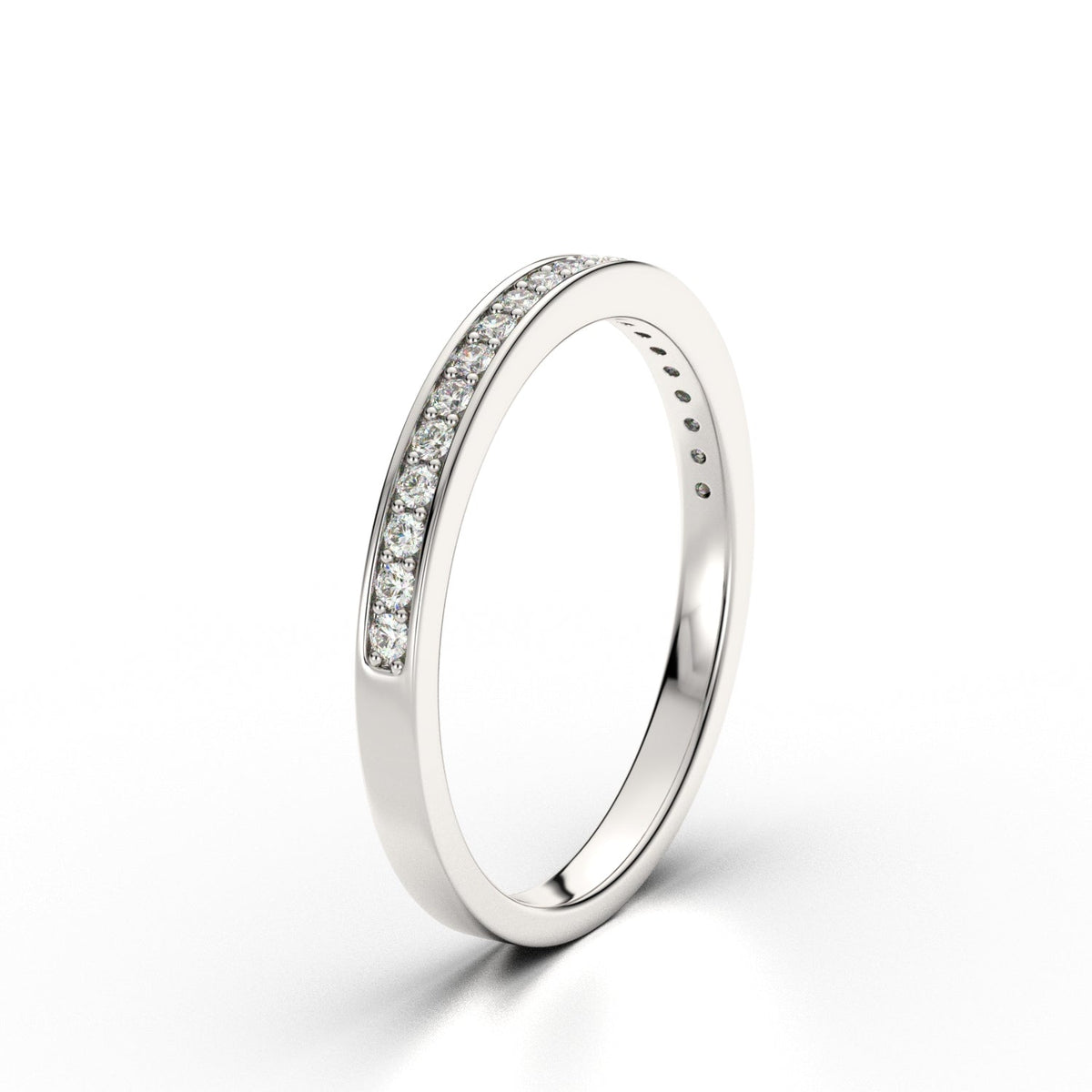 Inner-engraved slim white gold ring with subtle pavé detailing, timeless and personal.