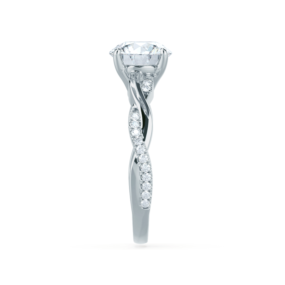 Side profile of the Wisteria ring in 18k white gold, highlighting marquise and round diamond accents