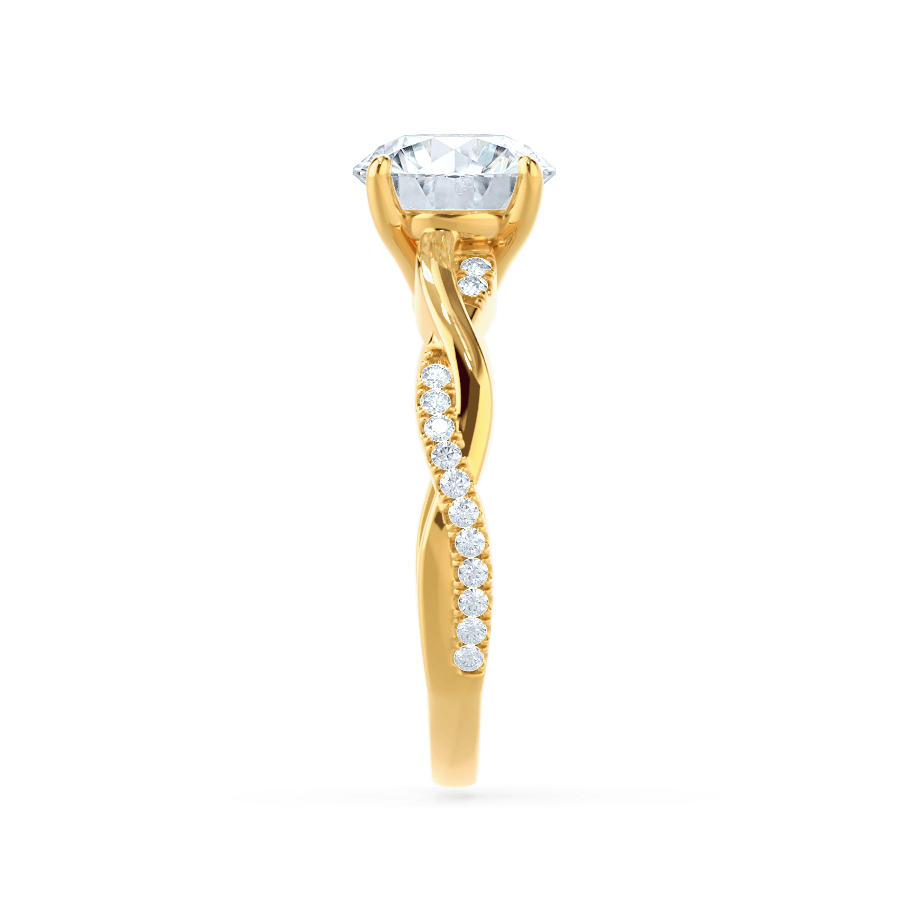Side profile of the Wisteria yellow gold ring showing graduated marquise and round diamond accents