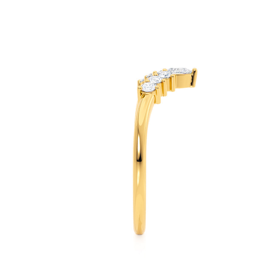 Side profile of a yellow gold band showcasing clean-cut baguette diamonds.