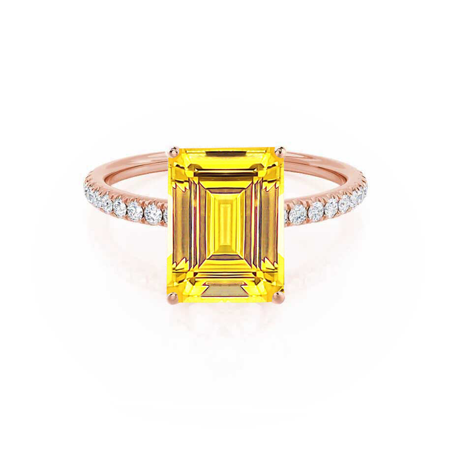 Front view of the emerald-cut yellow sapphire set in warm 18K rose gold, flanked by petite pavé diamonds for a graceful silhouette.