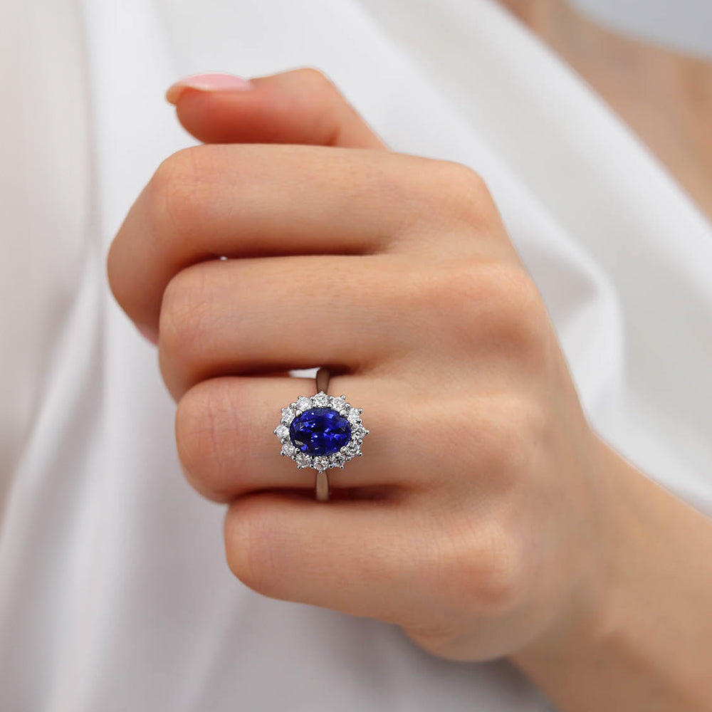 Model hand view 1 – Shows the ring worn on the hand to highlight its scale and luxurious sparkle.