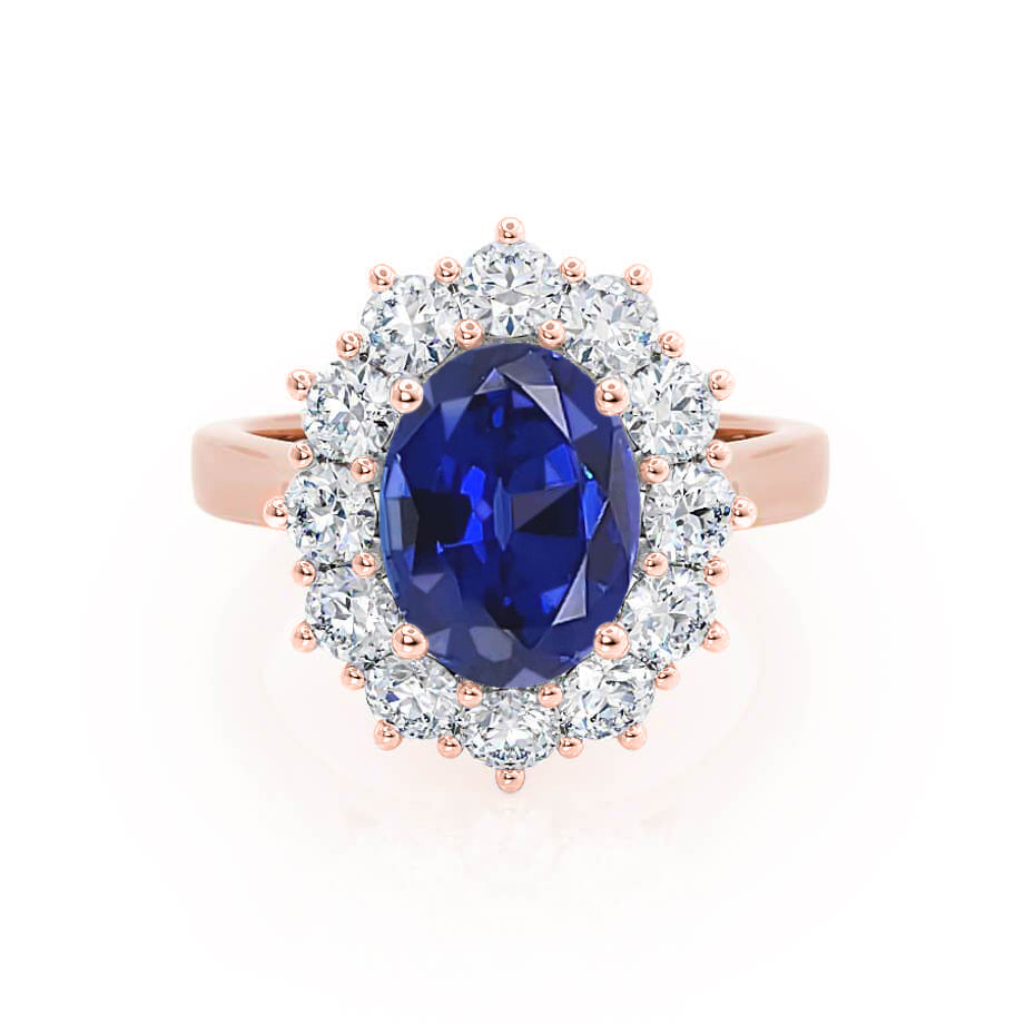 Front view – Showcases the vivid blue sapphire embraced by a brilliant diamond halo, set in romantic rose gold.