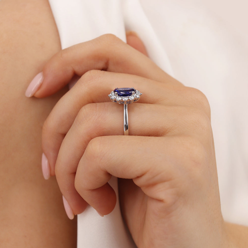 Model hand view 2 – Demonstrates the ring’s brilliance and deep blue hue, ideal for engagements or milestone celebrations.