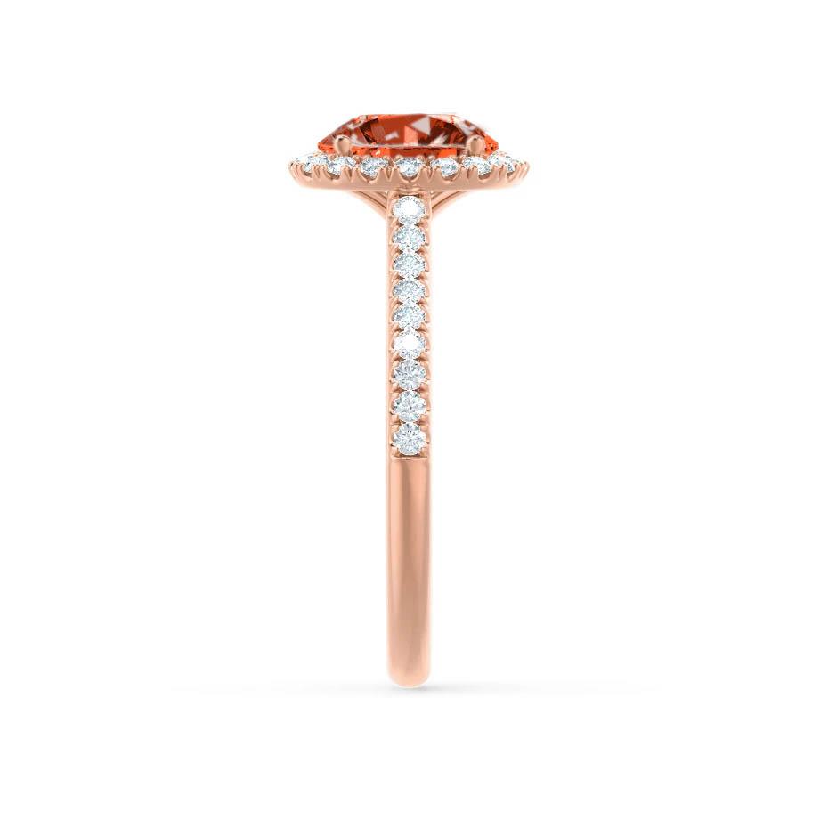 Side profile showcasing the graceful rise of the center stone and the petite rose gold band.