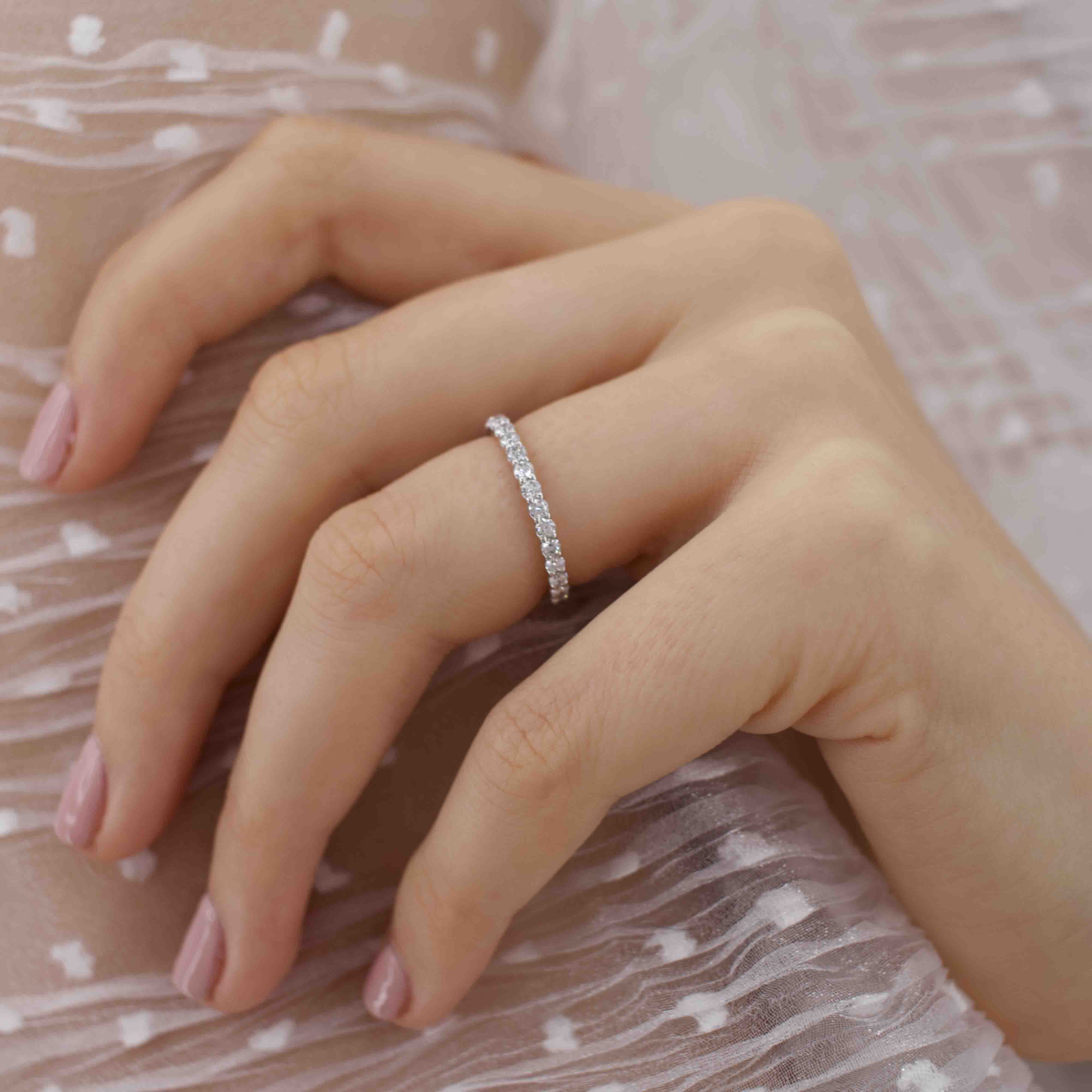 Another angle of the model hand wearing the Luna ring, shot in soft lighting to emphasize texture.