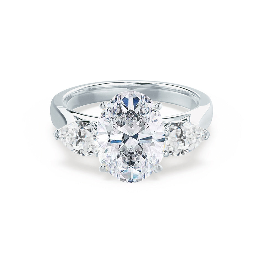 Oval lab diamond trilogy engagement ring in platinum with pear-shaped side stones, front view