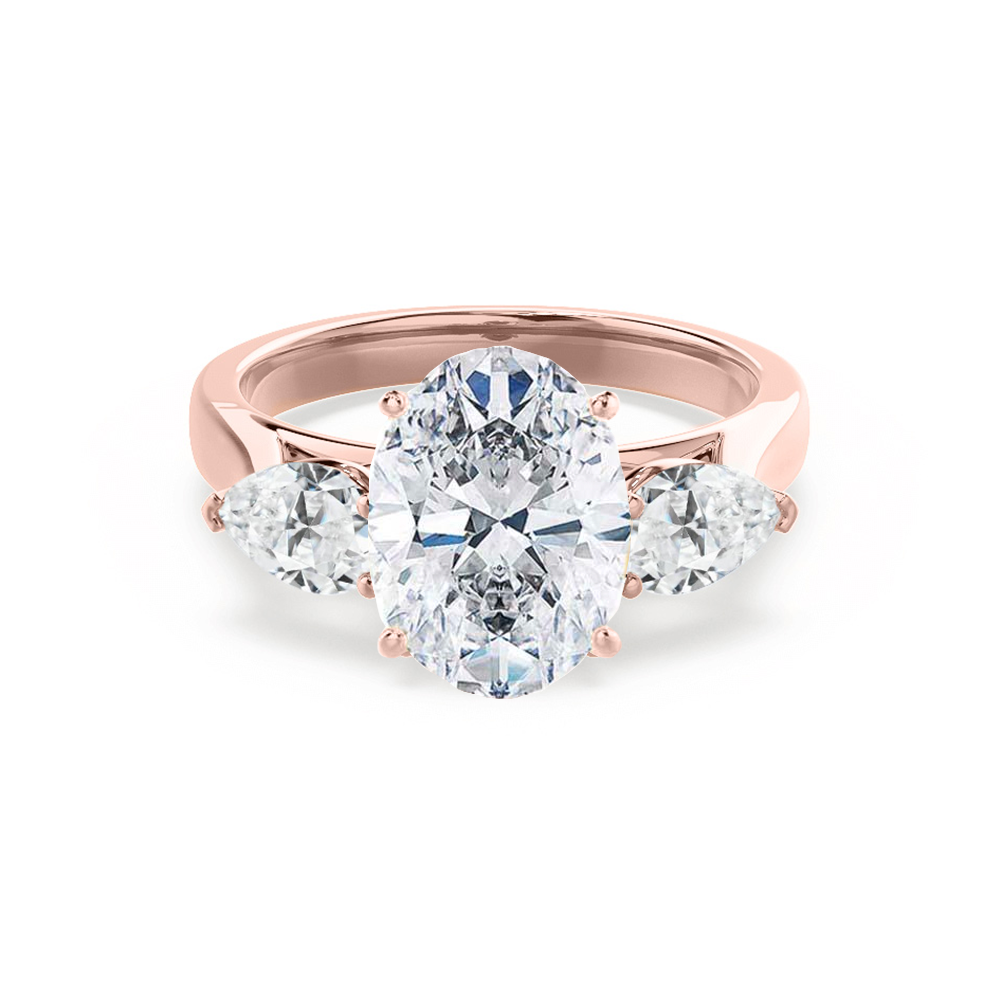Oval lab diamond trilogy engagement ring in 18k rose gold with pear-shaped side stones, front view