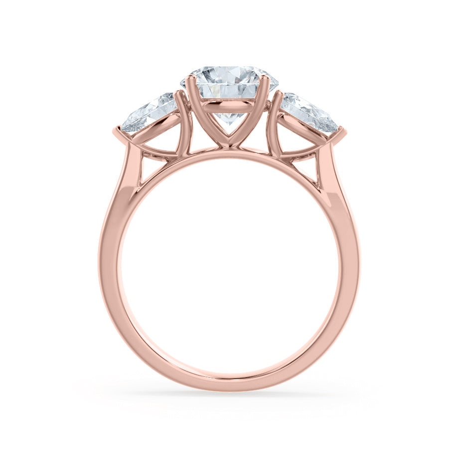 Profile view of oval cut lab diamond with pear side diamonds trilogy engagement ring in 18k rose gold