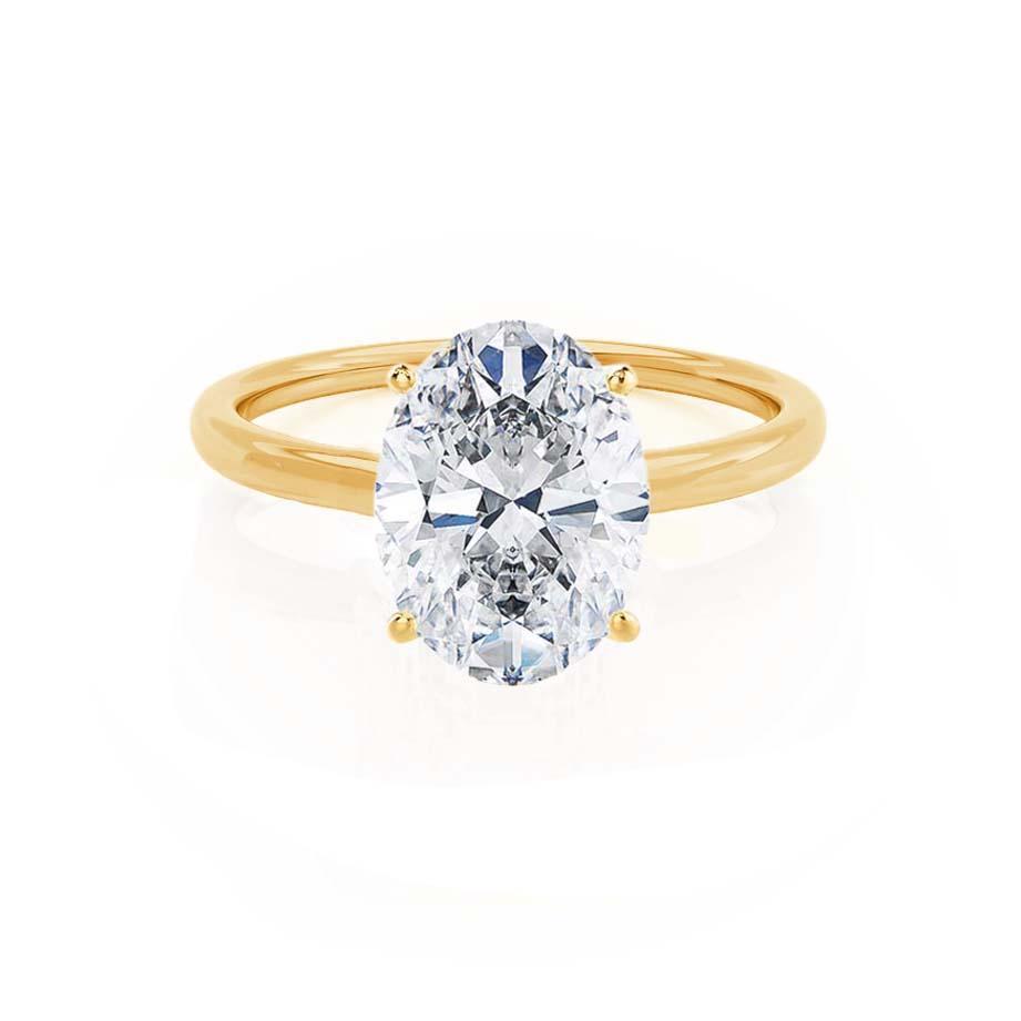 Front view of oval lab diamond solitaire engagement ring in 18k yellow gold