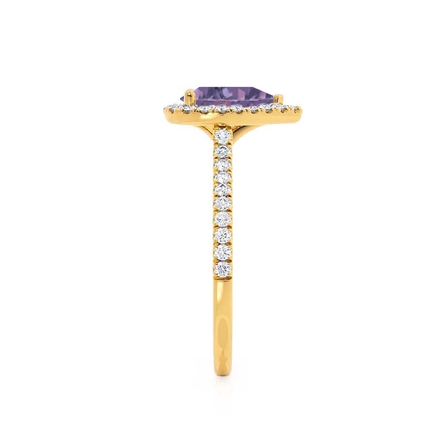 Side view – Delicate and lifted, the setting allows light to pass through the Alexandrite’s color-changing depths.