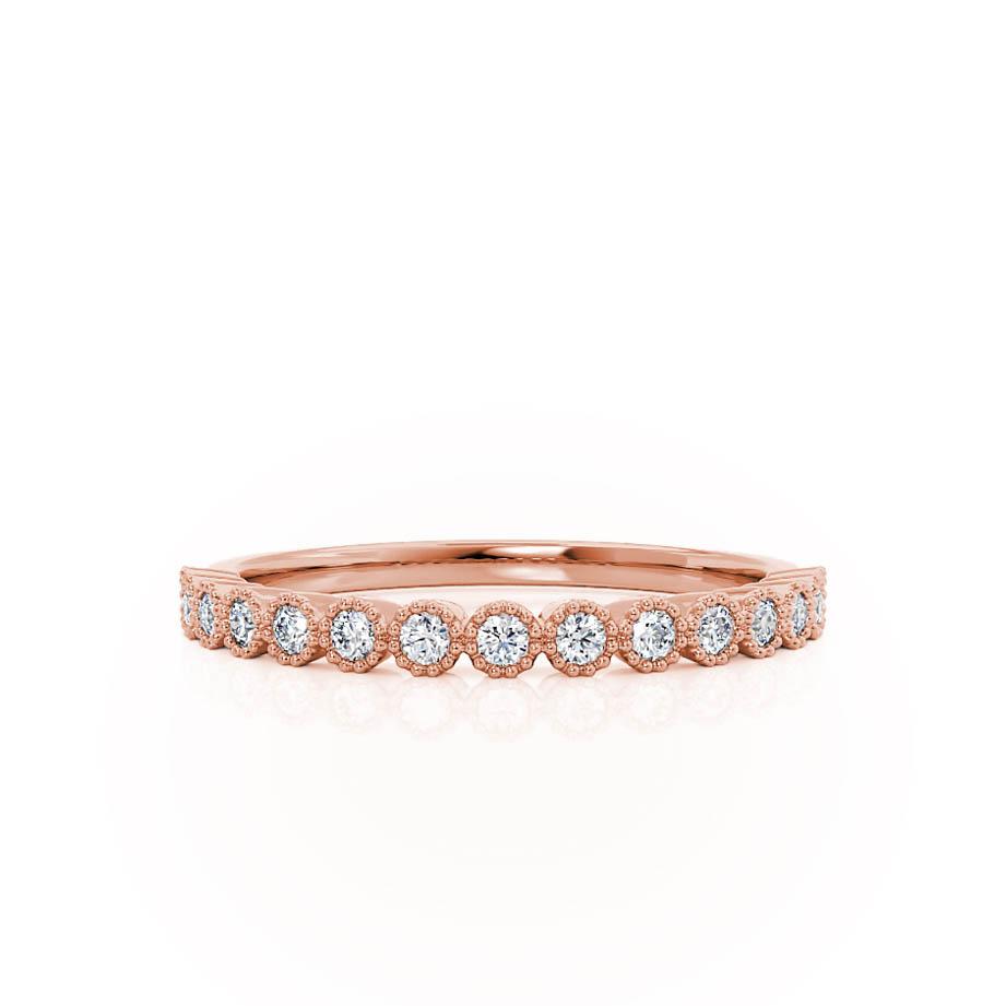 Top-down look at a rose gold band with uniformly set brilliant diamonds, timeless and balanced.
