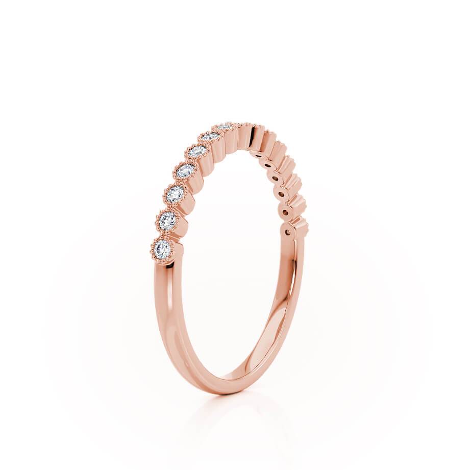 Side view of shared prong-set rose gold band, classic silhouette with clean sparkle.