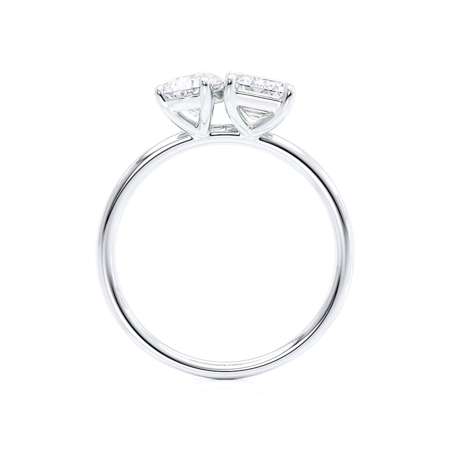 Top view of emerald and pear cut lab diamond Toi Et Moi engagement ring in platinum
